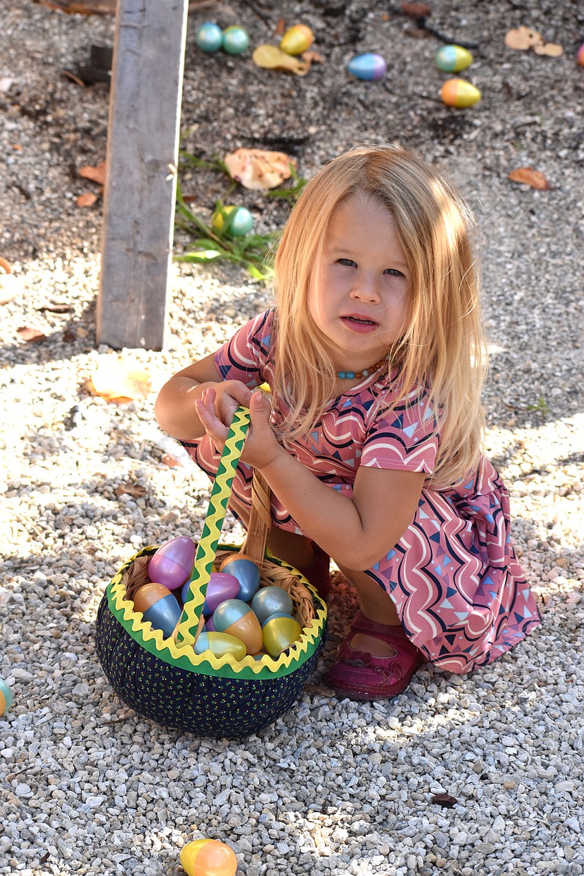 Spencer Hightower filled her basket with colorful eggs.
