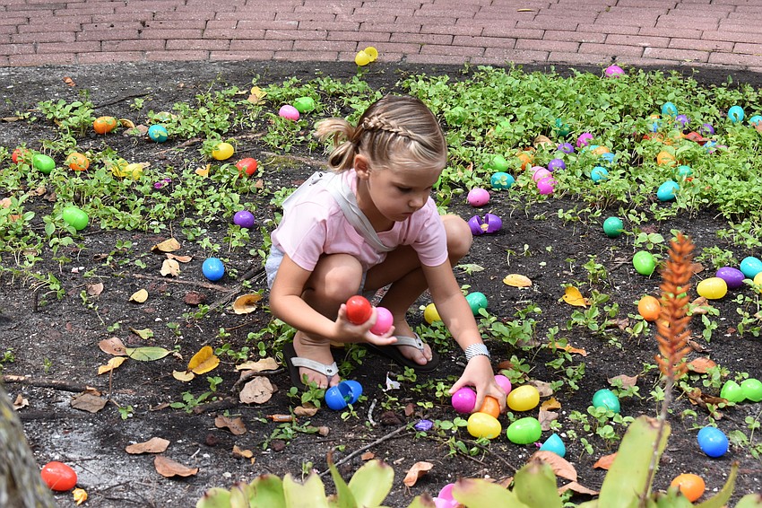 Lynlee Dunigan gathers her eggs.