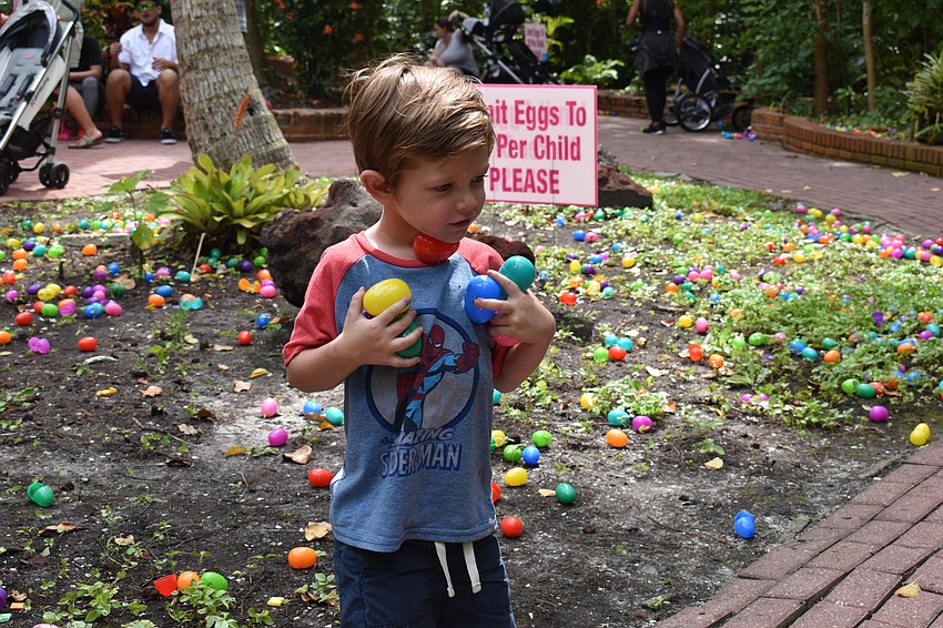 Titan Snyder holds as many eggs as he can.