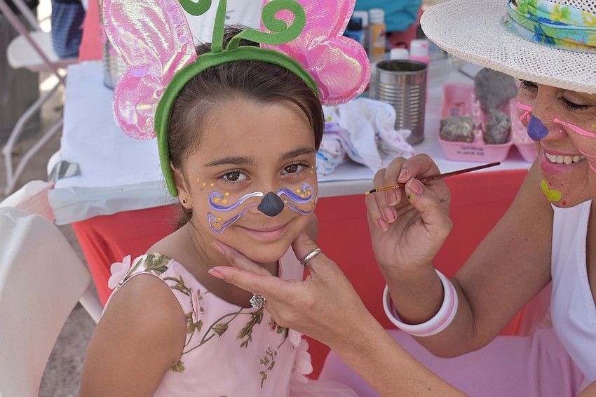 Miah Malur gets her face painted to look like a bunny.