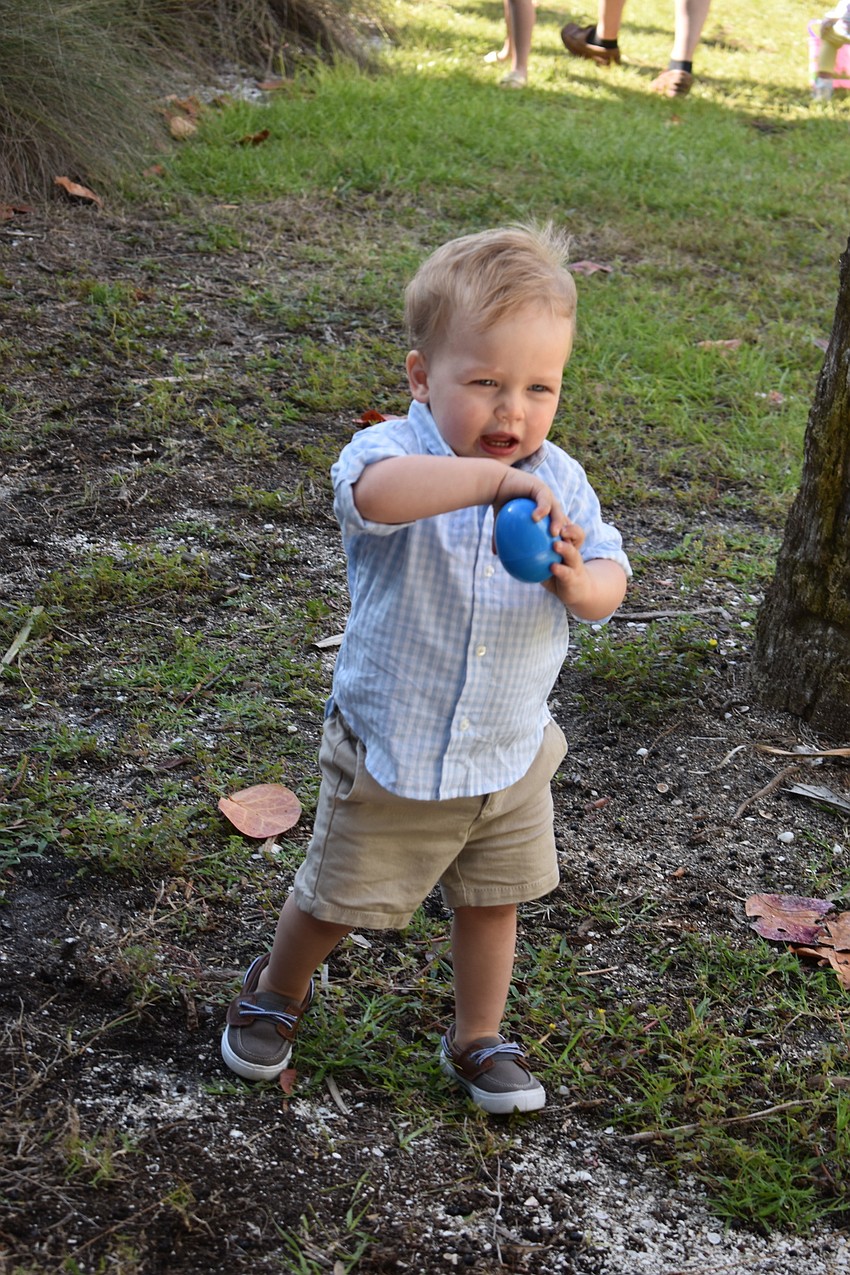 Dominic McCorry worked to open his egg and claim his prize, a piece of candy.