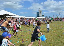 Children rush to the field for the hunt before the countdown finishes.