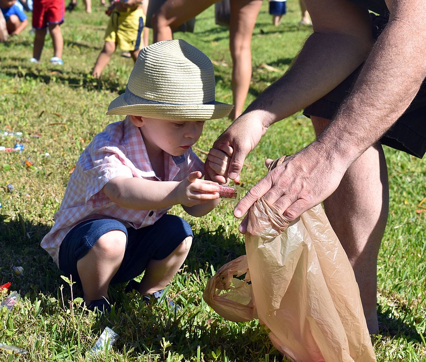 Emmett Clancy shows off his prize before putting it into his bag.