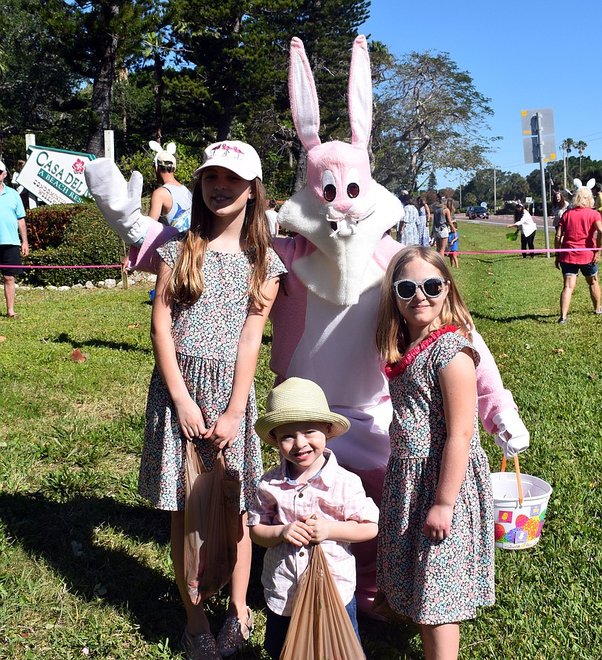 Lilah and Saige Torres and Emmett Clancy are all smiles when they meet the Easter bunny.