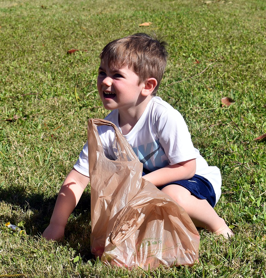 Henry Fetherston was all smiles as he picks up candy.