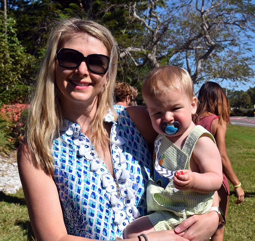 Caitlin and Kase Fetherston take a break from egg hunting to smile for a photo.