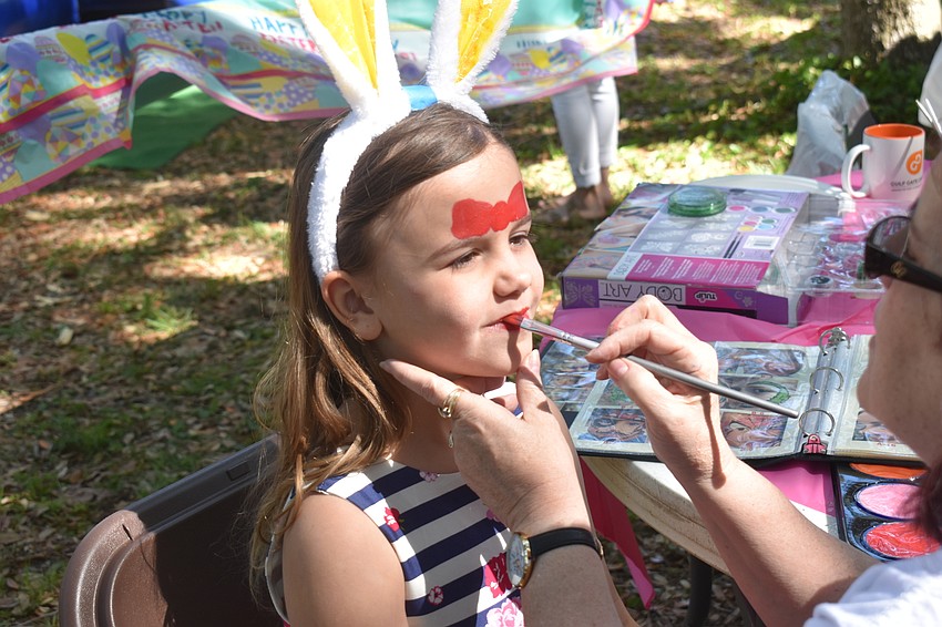 Madelyn LeClair gets her face painted during the festivities.