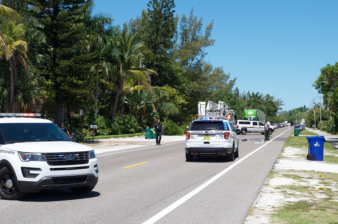 Police investigate the scene of a fatal bicycle crash on Gulf of Mexico Drive.