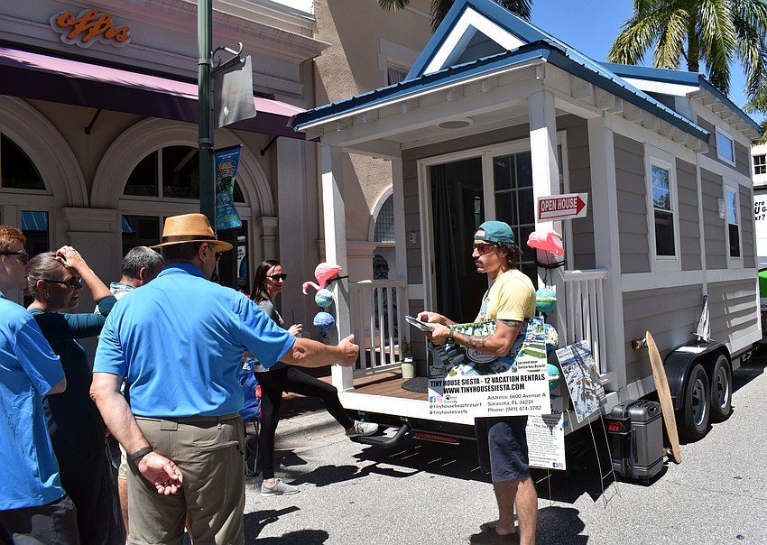Dylan Jon Wade Cox shows off a Tiny House Siesta unit, which people can book while on vacation.