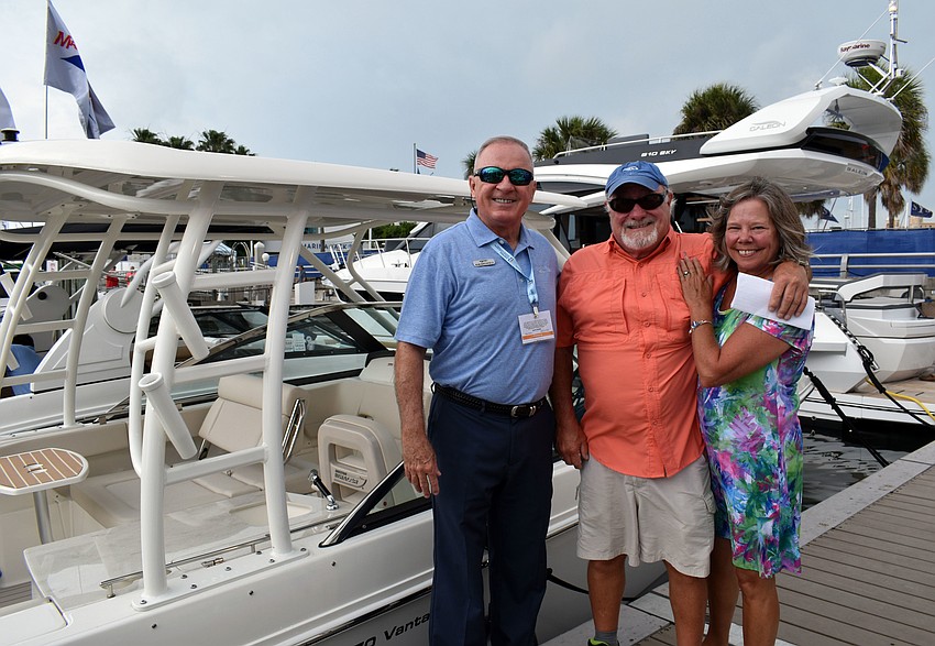 Bob and Chris Ricker proudly show off the 270 vantage Boston Whaler they bought from MarineMax employee Rob Birchfield.