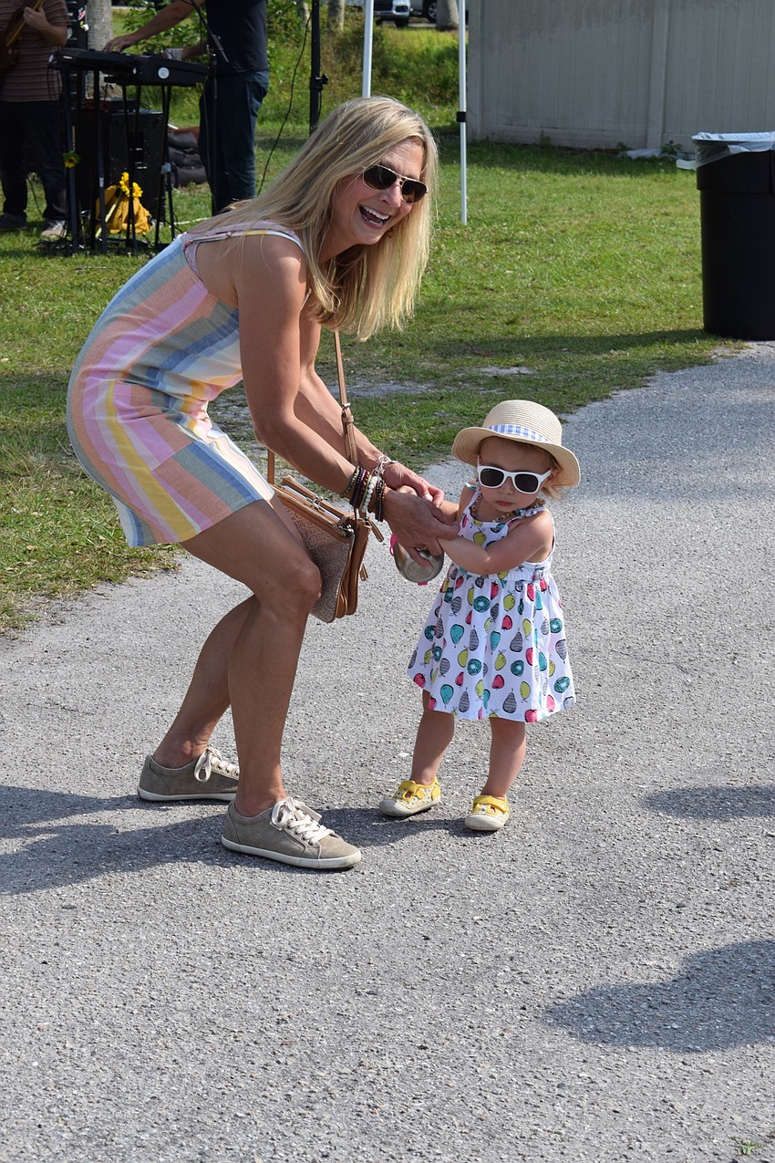 Country Club's Deirdre Bowen danced to the live music with her granddaughter, Quinly Collins.