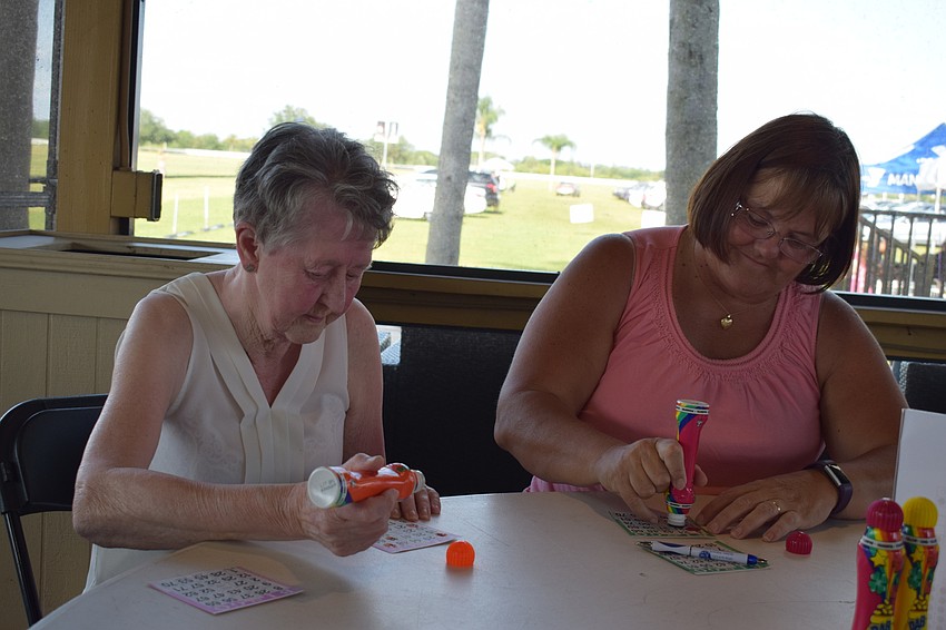 Violet McGregor, at her first time at The Market, won the first round of bingo while playing with her daughter, Carol Spence.