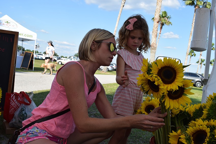 Emily McLachlan, of Country Club East, picked out sunflowers with her daughter, Molly.