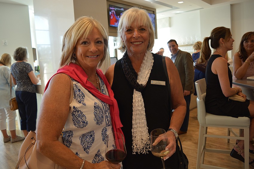 Lake Club resident Tammy Hurt catches up with friend and Giving Circle member Sharyn Nassau.