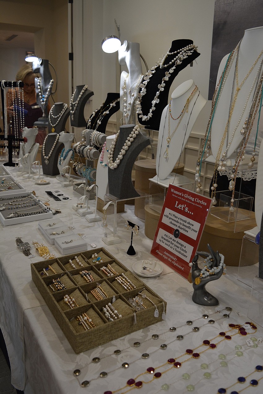 Ladies browsed jewelry for sale. Twenty percent of proceeds were donated to the cause.