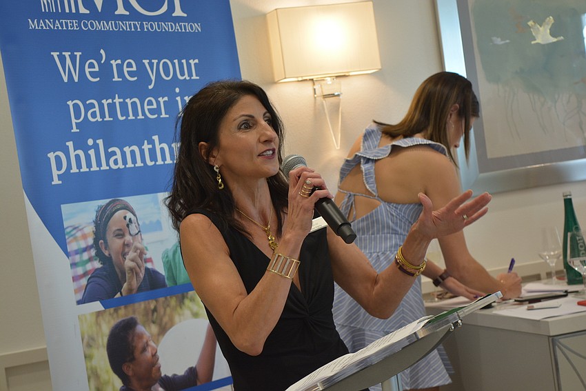 Master of Ceremonies Barbara Najmy encourages women to be giving and use their power to 