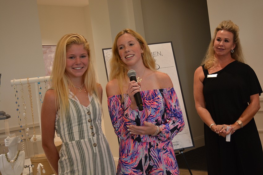 Sisters Maeve and Mairead Studdiford, of Lake Club, founded Two Steps Further to help impoverished youth think about higher education. They thanked women for the donation.