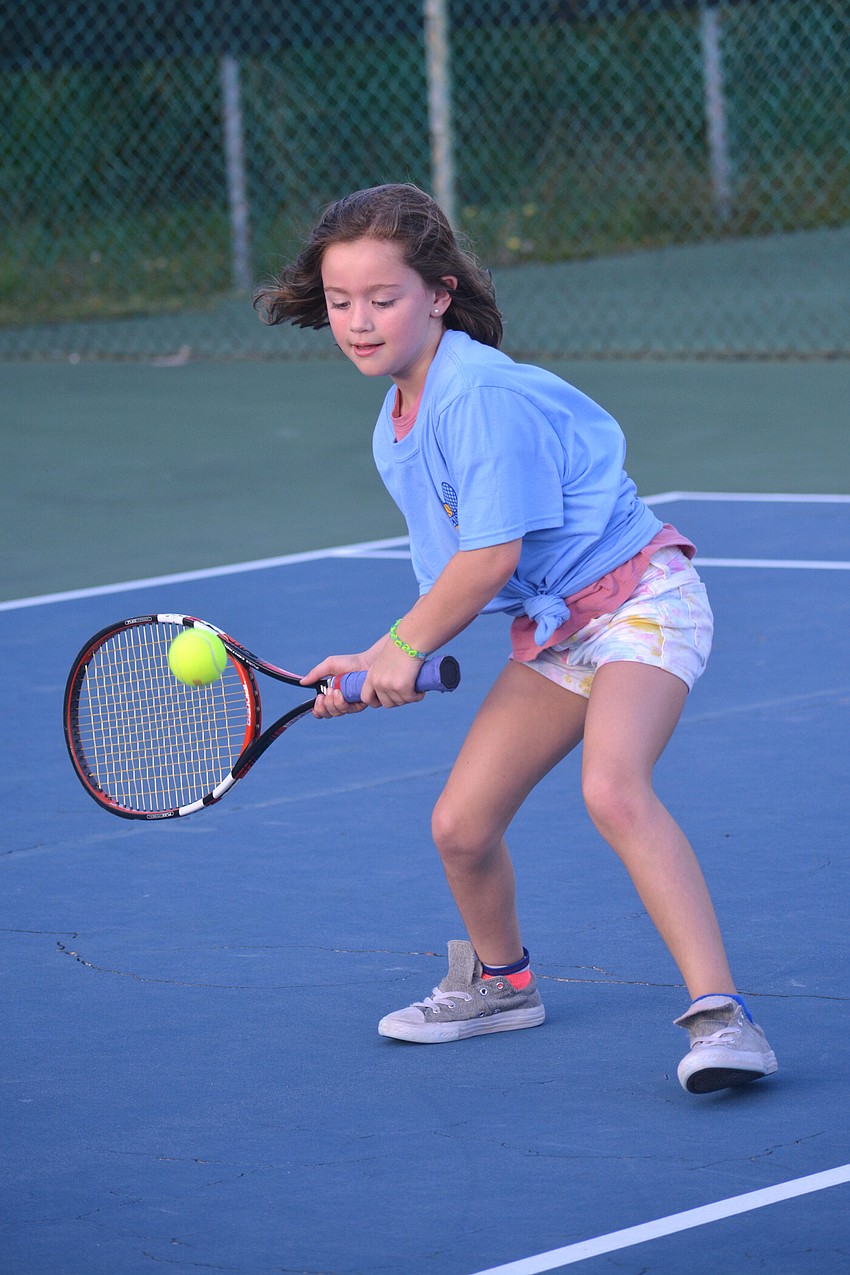 Scarlett Gratton, 8, already has a strong forehand shot.