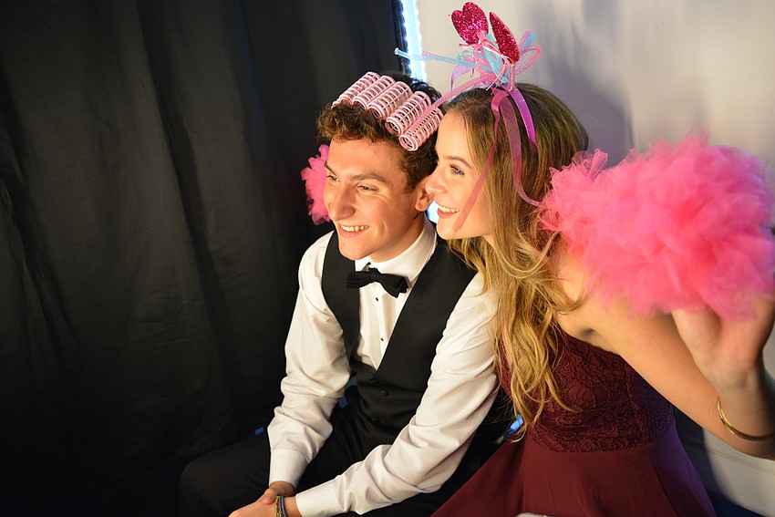 ODA's Xavier Koffman and his date, Lakewood Ranch High School's Kamila Kemenyfy, pose for a photo booth picture.