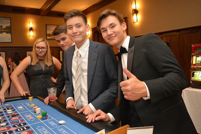Seniors Damir Sarsekeyev and Max Schukenov play roulette.