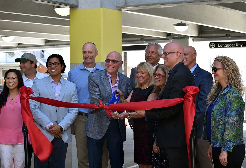 Those who had a hand in bringing the garage to St. Armands cut the ribbon.
