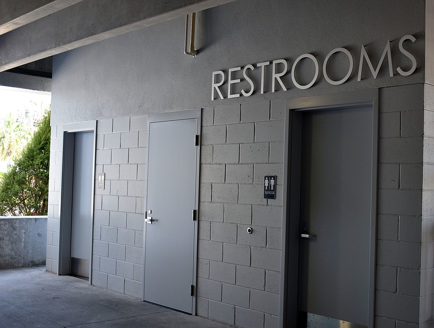 Two bathrooms are situated near the entrance to the garage.