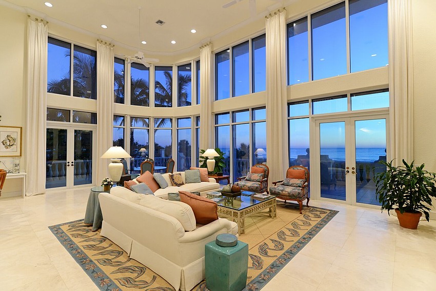 Wide windows on the rear of the home show off the beach views.