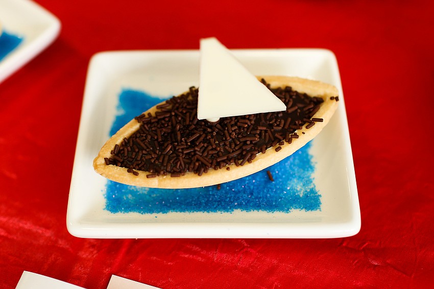 Dessert was in the shape of a sailboat.