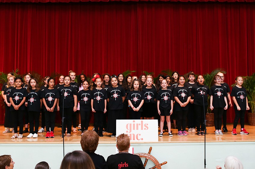 The Girls Inc. singers open the program with a couple songs.