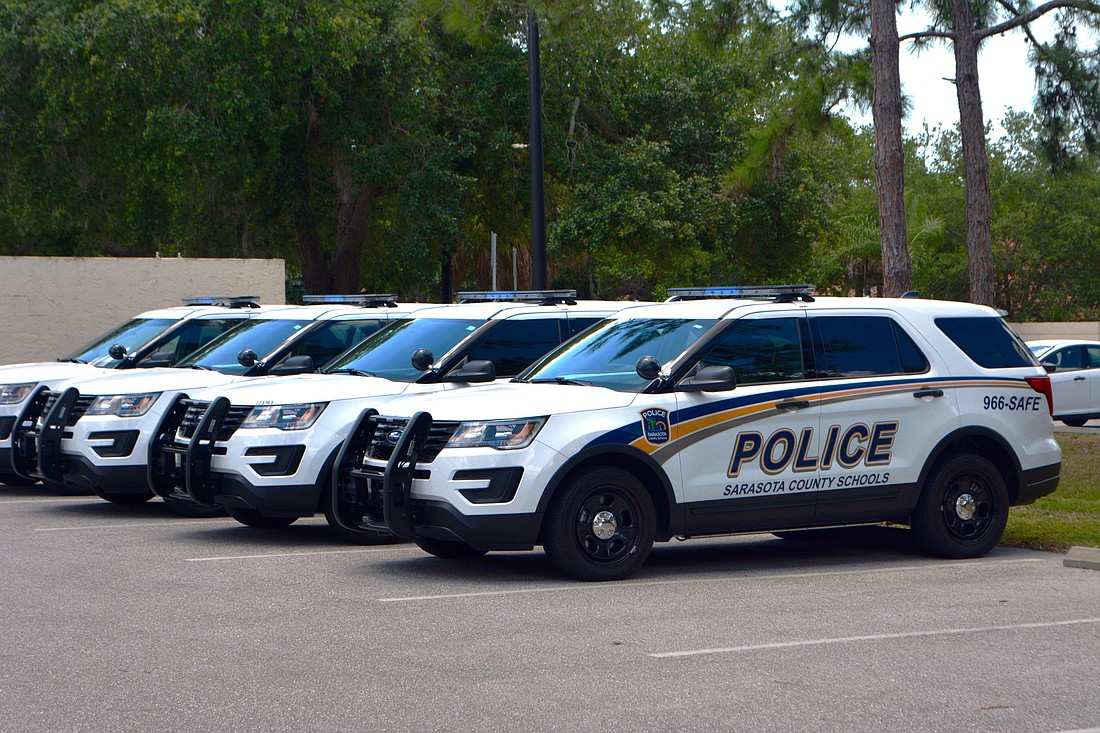 A line of Sarasota County Schools Police Department cruisers sit outside of the district offices at The Landings.