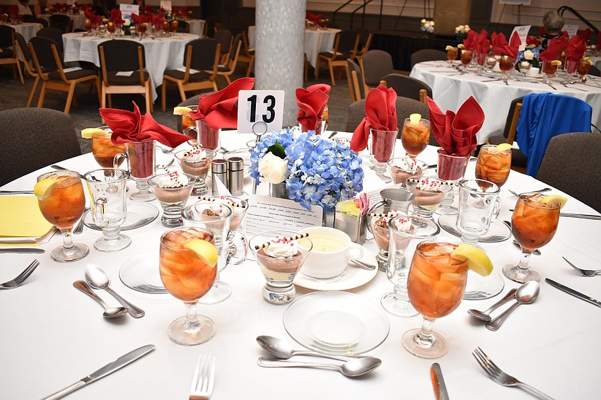 Every table was adorned with a floral arrangement and already featured dessert.