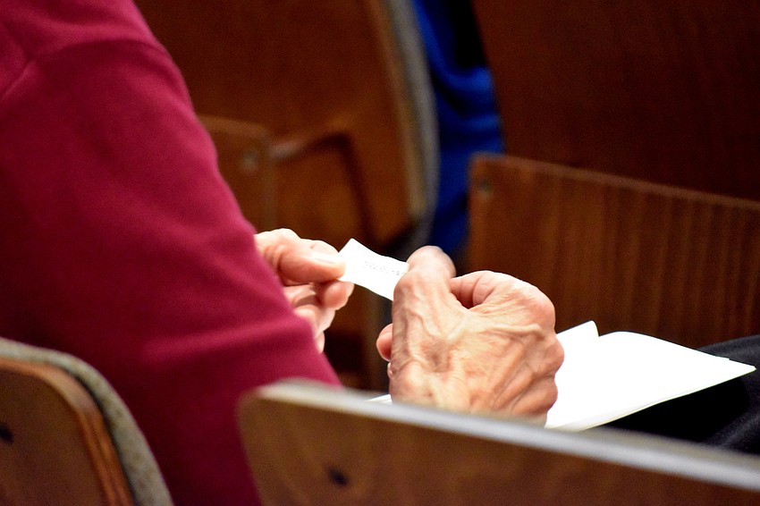 Guests were given slips of paper with the name of someone who died during the Holocaust.