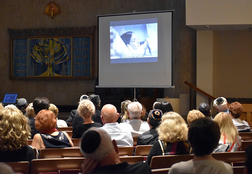 Guests watched a video about the Holocaust.