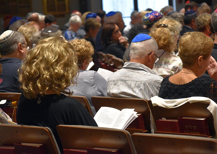 A guest turns to her pamphlet for the proper words to respond.