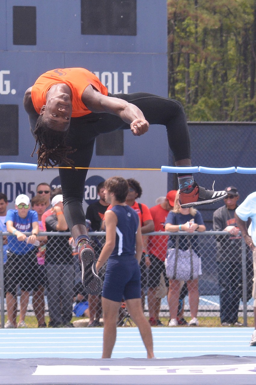 Sarasota High senior Robbie Peterson floats over the high jump bar.