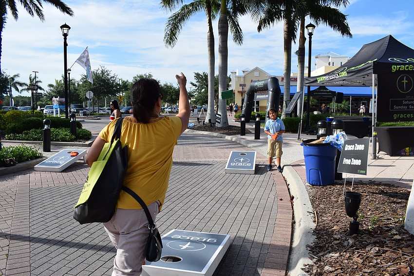 Amanda Salazar, of Creekside Ranch, played cornhole with her grandson, Xavi.
