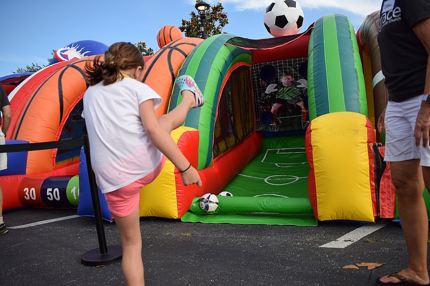Sarasota's Zoey Kollet gives a soccer ball a mighty boot.