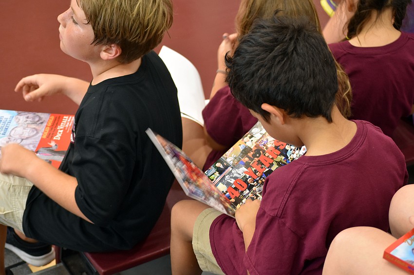 A student looks at his free copy of 