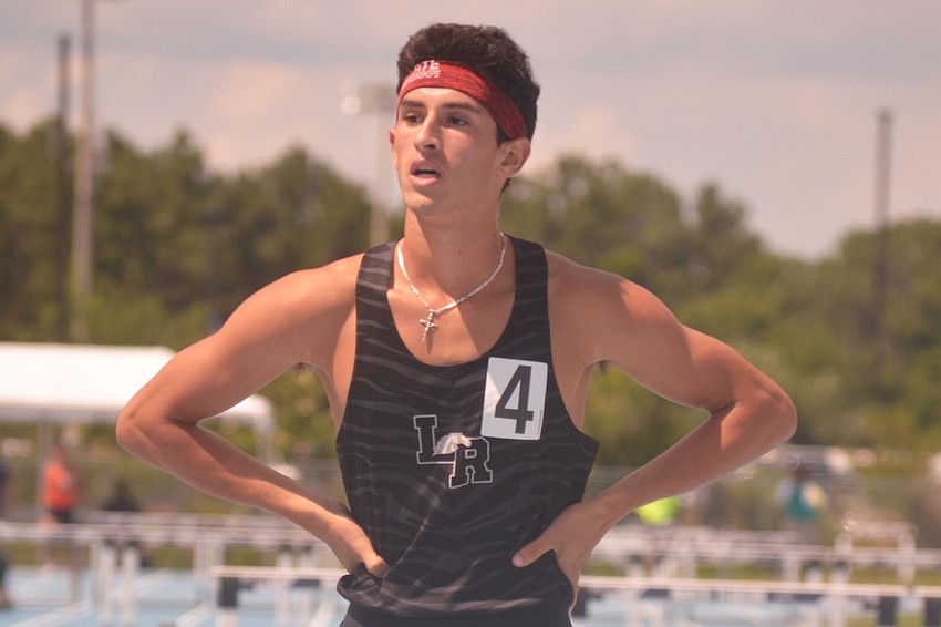 Lakewood Ranch senior James Rivera takes a breather after finishing second in the 4A boys 300-meter hurdles.