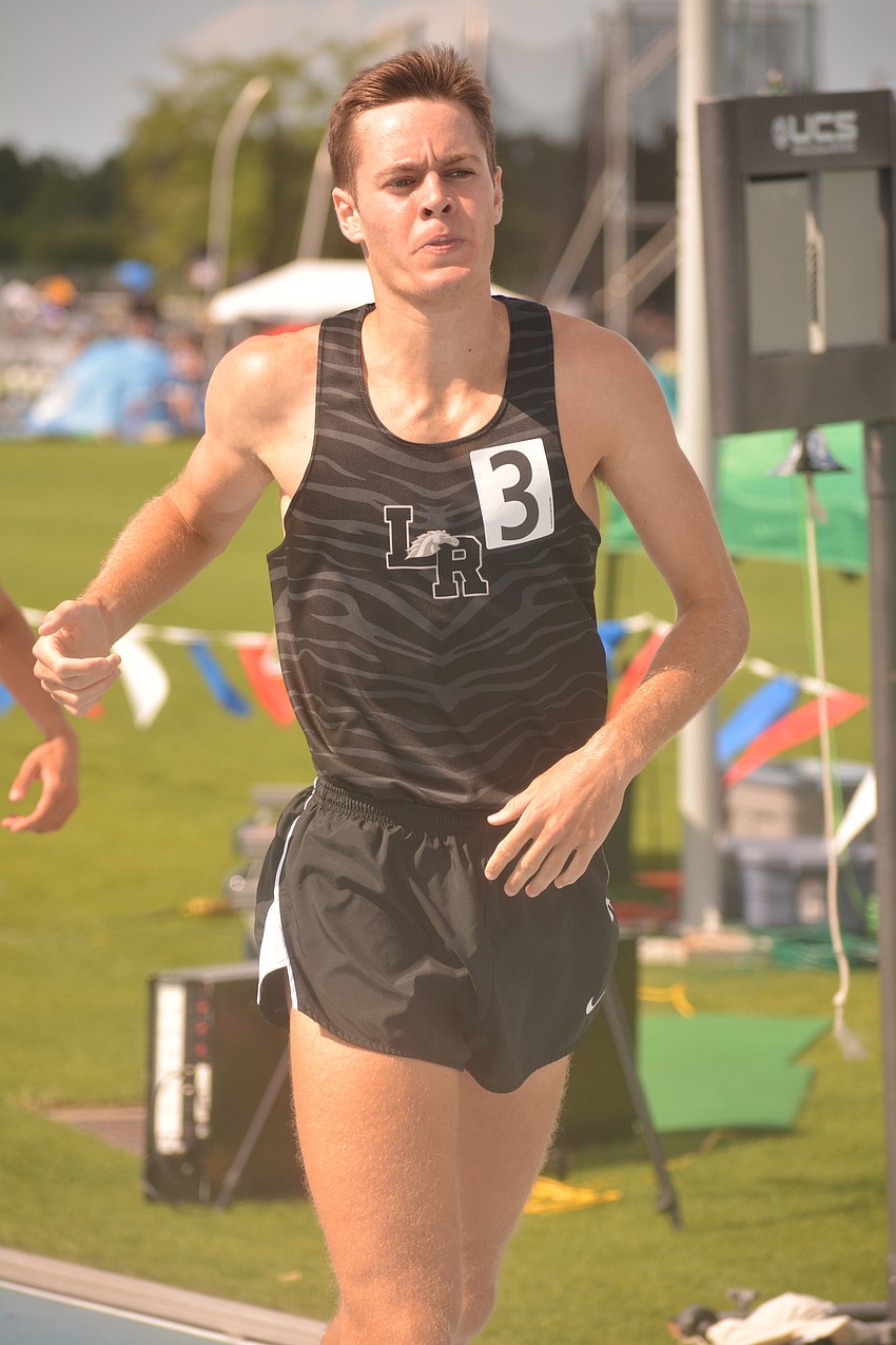 Lakewood Ranch senior Johnny Reid comes to a halt after the 4A boys 1600-meter race. Reid finished second.