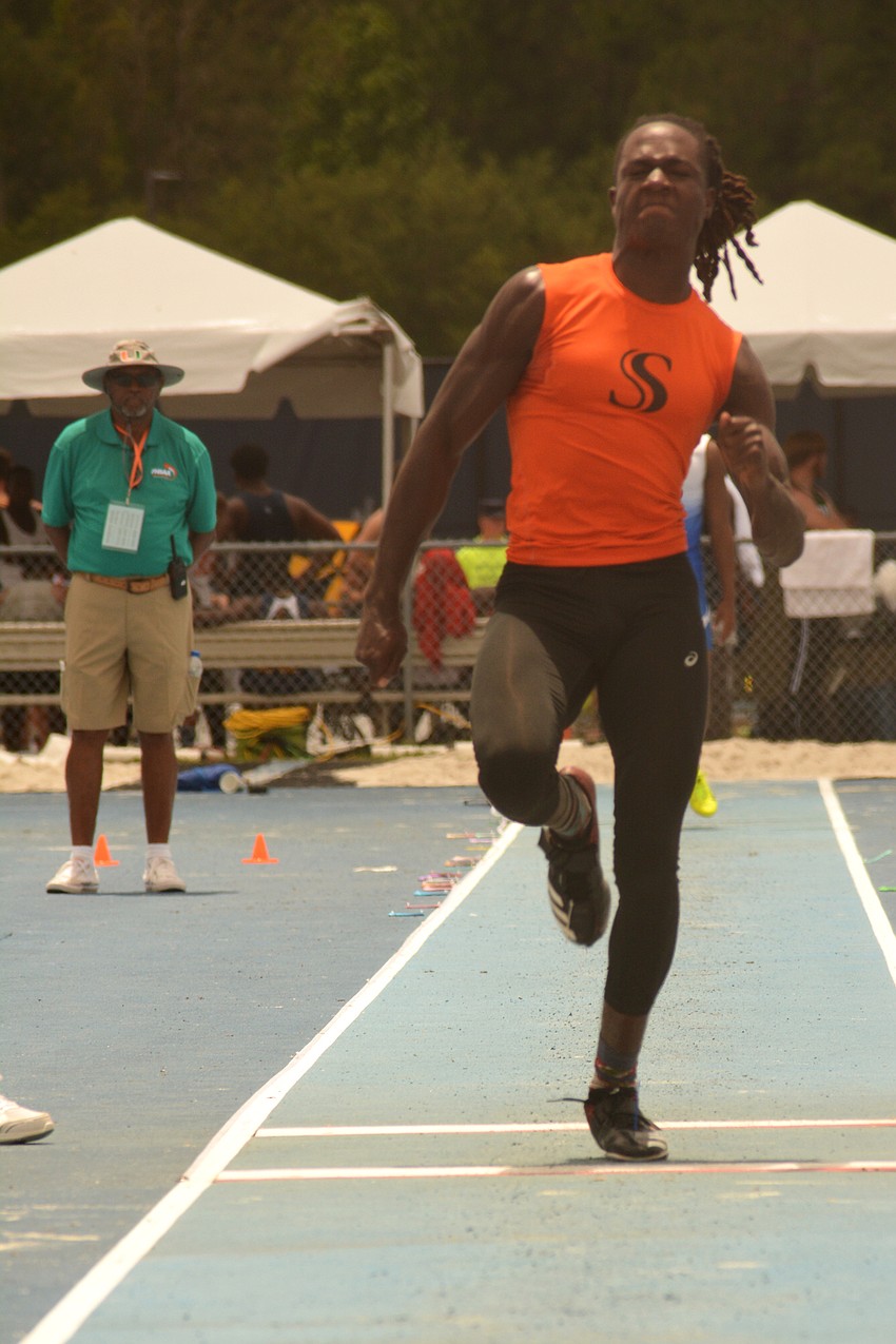 Sarasota senior Robbie Peterson charges down the 4A boys triple jump track. He won the event.