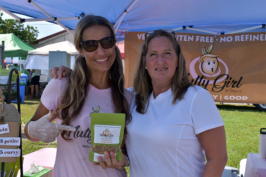 Molly Moore and Karen Black show off their gluten-free, vegan-free product.