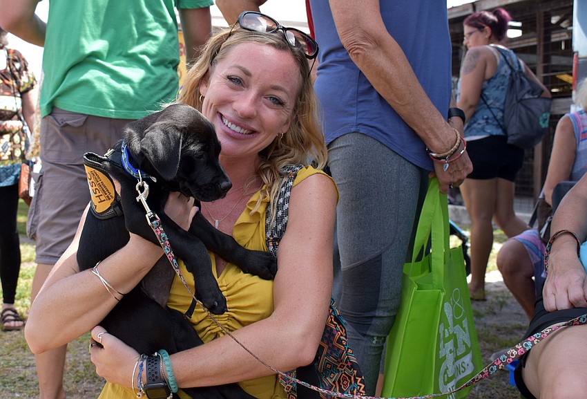 Kendal DaSilvia snuggled up with lab/retriever mix Fiona.