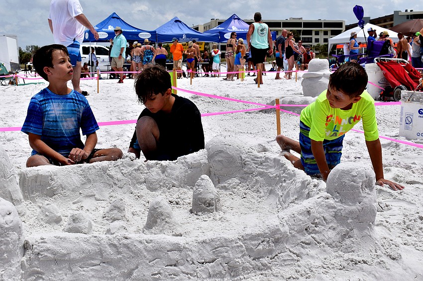 Jack Jones, Connor Price and Parker Price put the finishing touches on their castle.