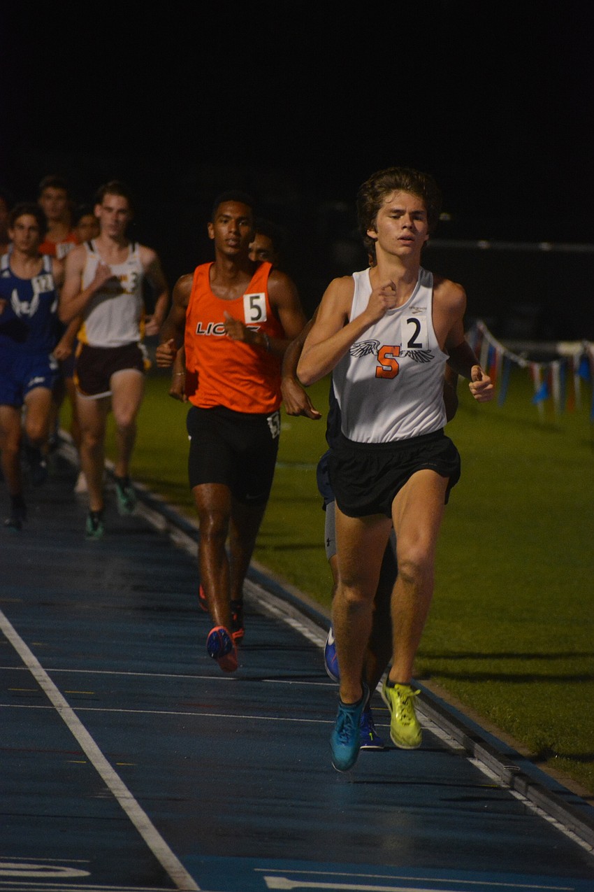 Sarasota senior Ben Hartvigsen paces the pack during the 4A boys 3200-meter race. He would finish second.