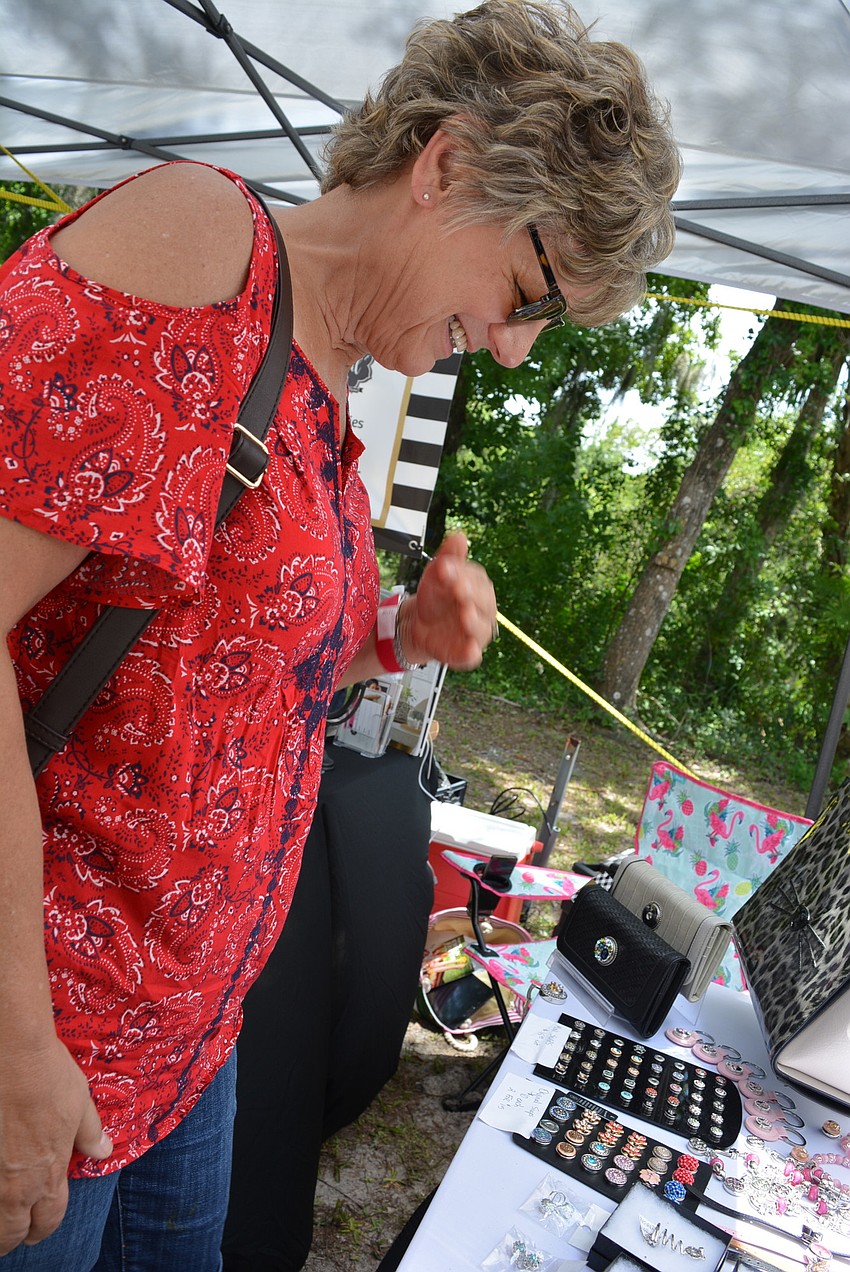 Myakka's Barbara Miller checks out jewelry and other items from Magnolia and Vine.