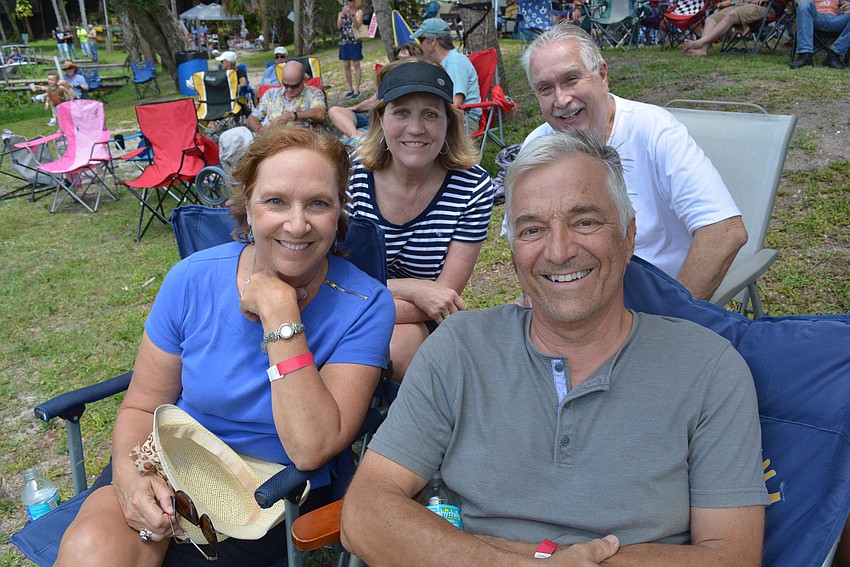Clockwise from front left: Linda Pretyka, Monica and Bubba Rice and Bill Pretyka usually hear the music from their homes, but decided to come out for the festival.