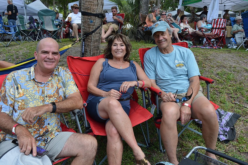 Creekwood resident Thad Cummins hangs out with River Place residents Sandy and Mike Opsomer. 