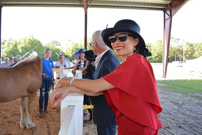 Sophorn Touch, who came with friend Chris Naale, says watching the horses is beautiful.