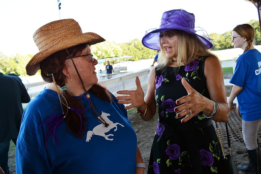 SMART rider Jessica Storti talks with Lakewood Ranch's Michelle Lubrino about driving carriages with her horse, Sterling.